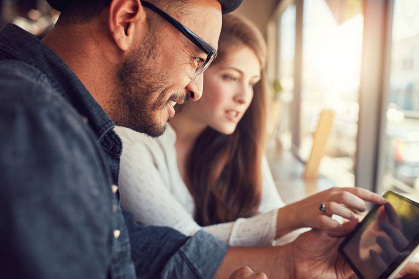 Couple-looking-at-tablet