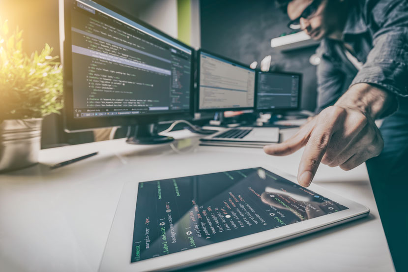 developer-reaching-for-tablet