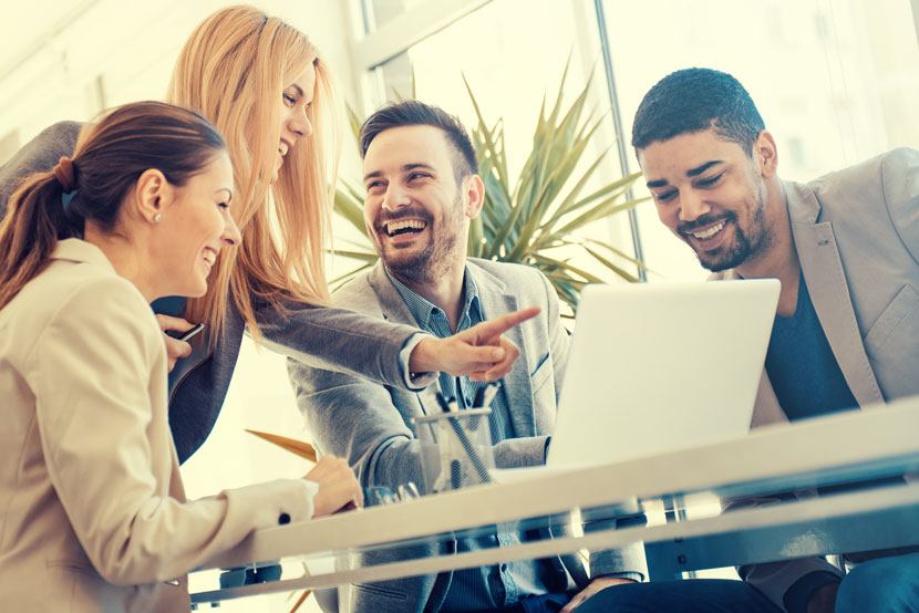 Group-of-people-looking-at-laptop
