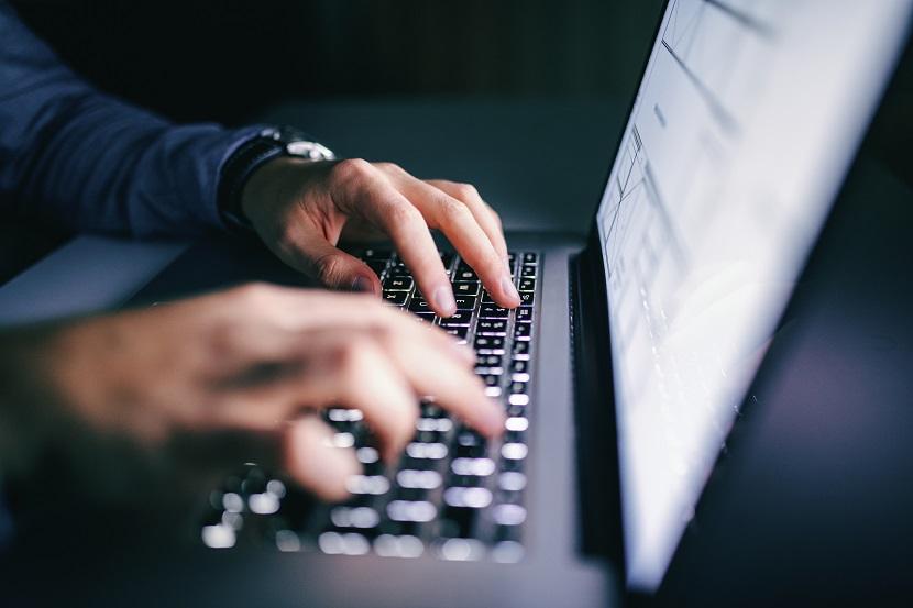 Man typing on a computer